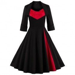 Vestido vintage negro con mangas y cuello vuelto con lazo rojo