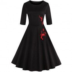 Black vintage dress decorated with embroidery floral print